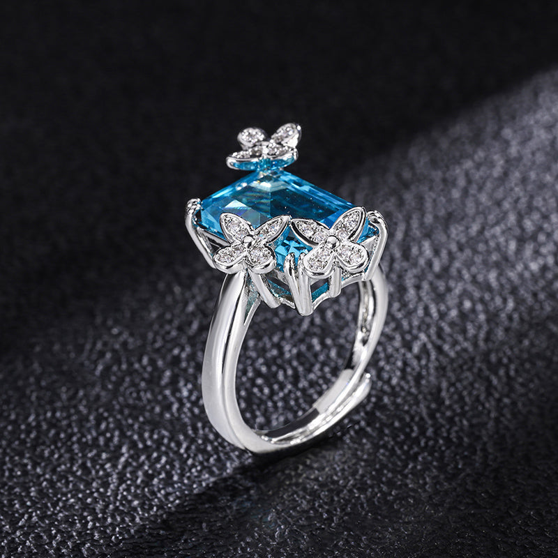 Title: Elegant Blue Topaz Ring with Floral Diamond Accents – Sterling Silver Adjustable Ring for Women