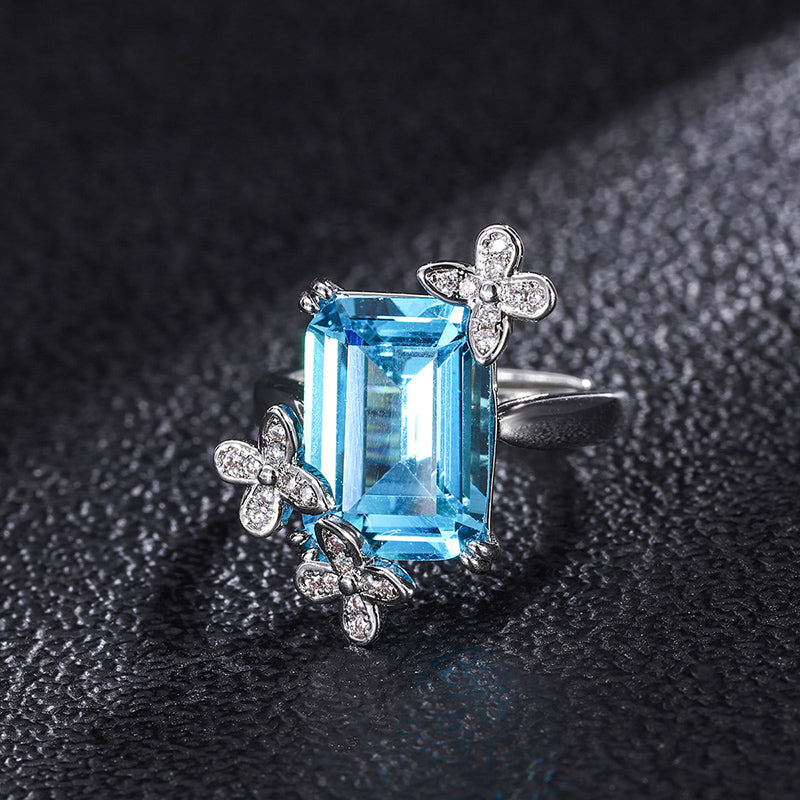 Title: Elegant Blue Topaz Ring with Floral Diamond Accents – Sterling Silver Adjustable Ring for Women