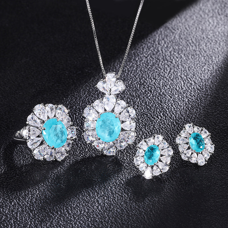 Light Blue Oval Cubic Zirconia Jewelry Set – Ring, Necklace & Earrings with Silver-Tone Design, Floral Halo Detail