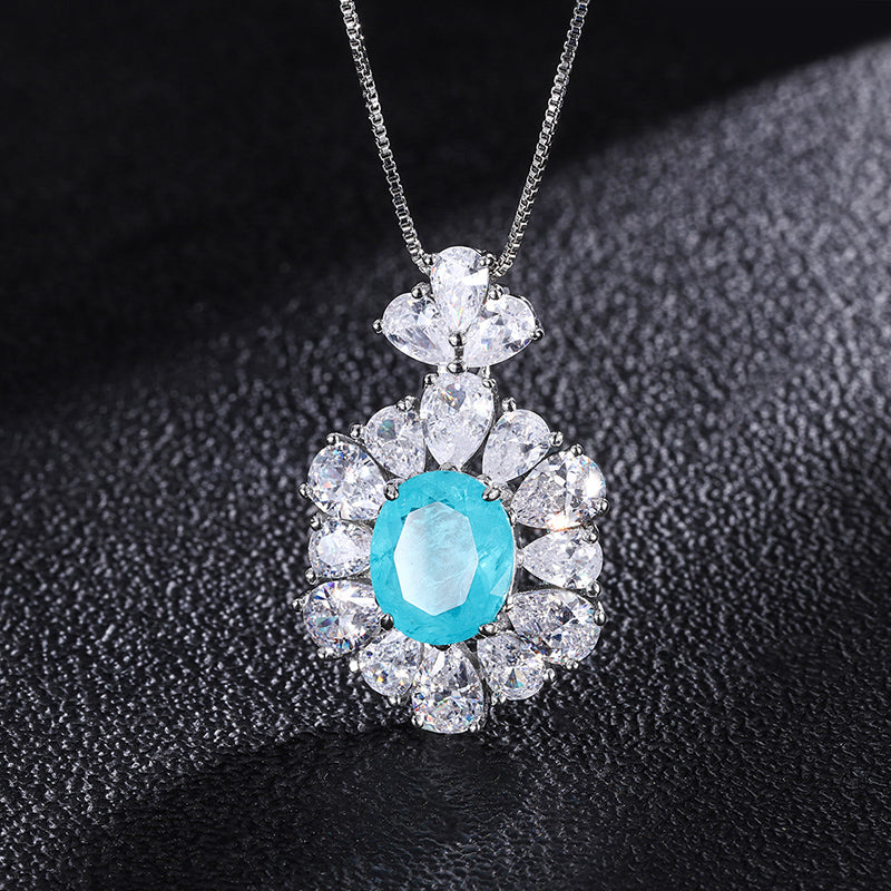 Light Blue Oval Cubic Zirconia Jewelry Set – Ring, Necklace & Earrings with Silver-Tone Design, Floral Halo Detail